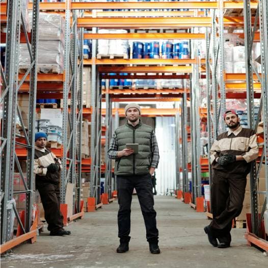 Men Standing inside Warehouse